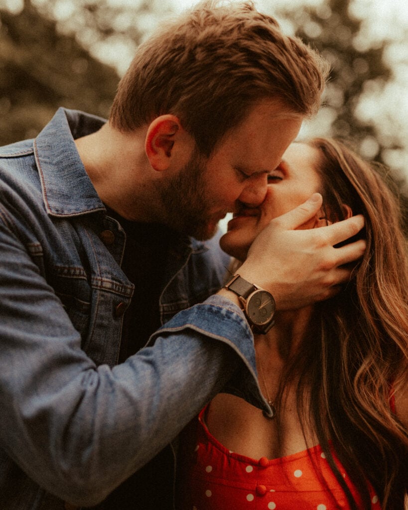 couple getting close to kiss during romantic engagement photo