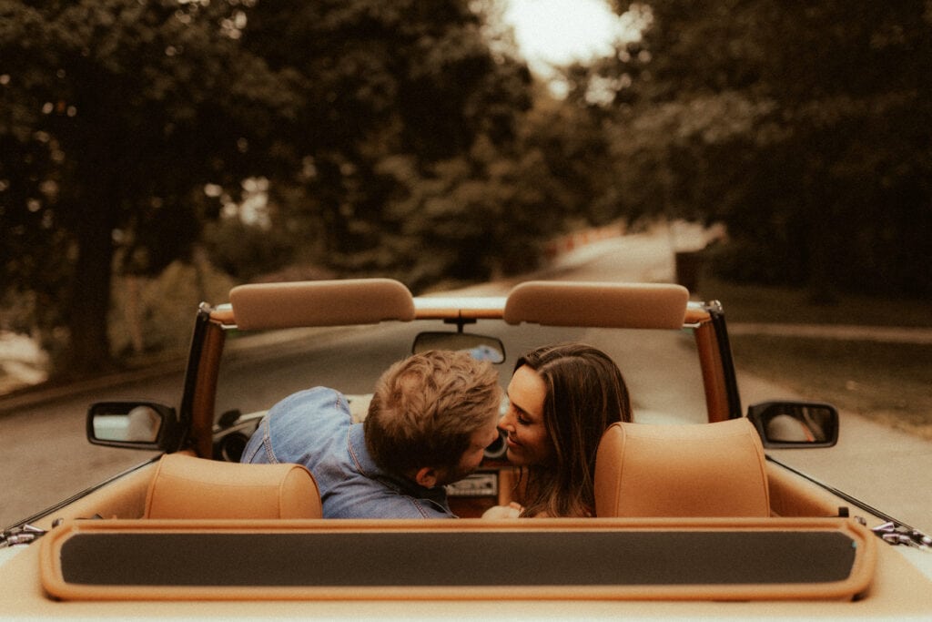 couple kissing in vintage 1980s mercedes